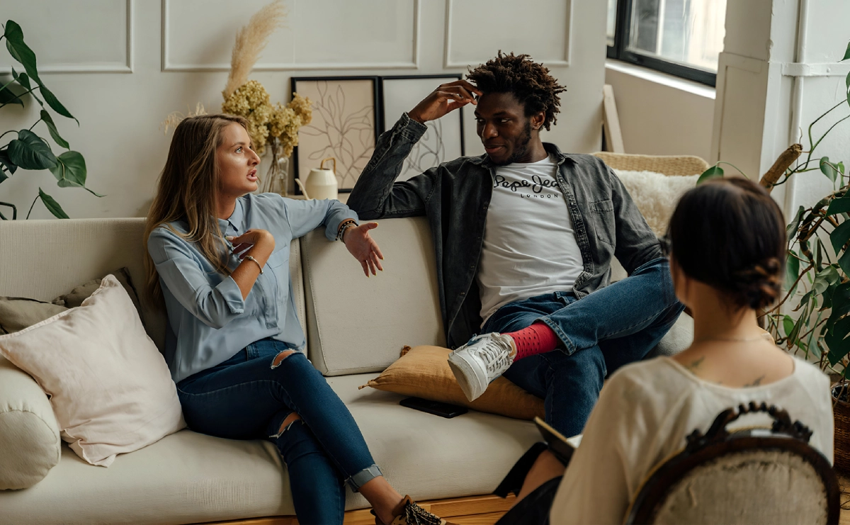 A group of people sitting on top of a couch.